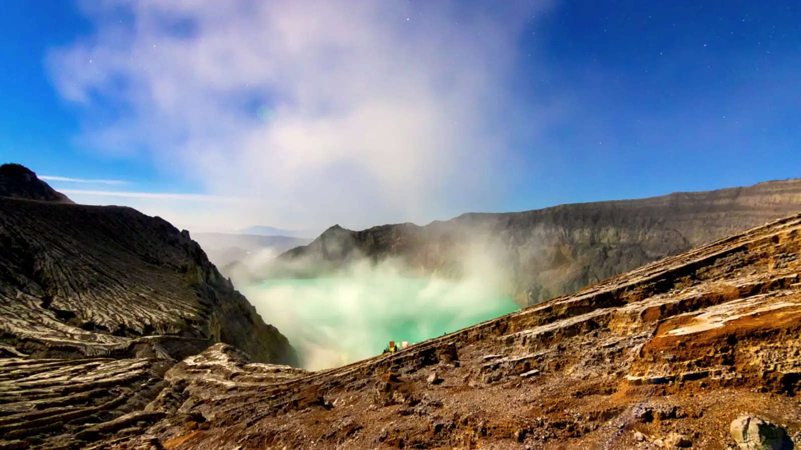 Protecting Mobile Devices at Ijen Traveler using a protective pouch for their smartphone while hiking Ijen