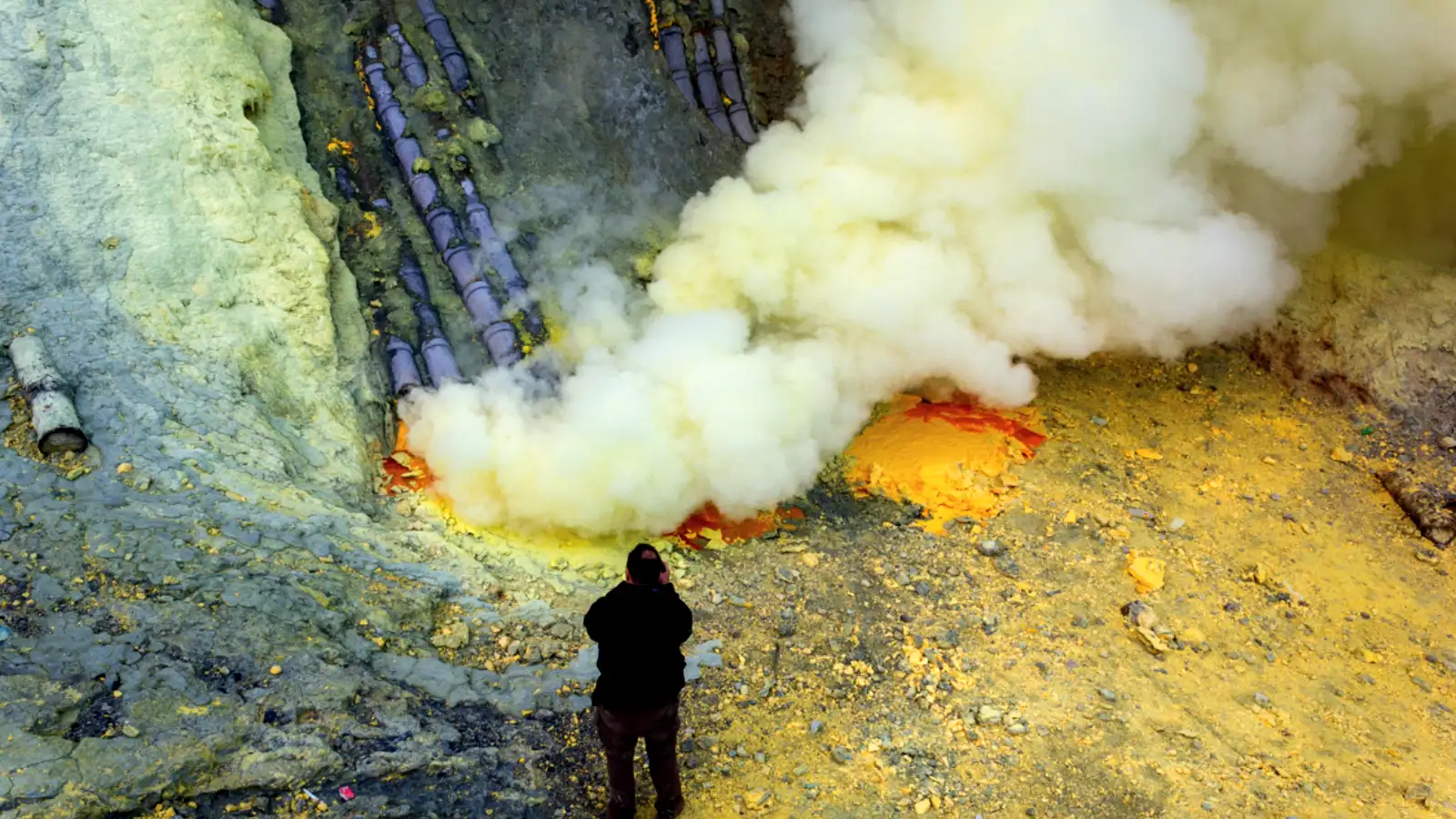 The Resilient Sulfur Miners of Kawah Ijen Sulfur miners carrying heavy baskets of yellow sulfur rocks out of the Ijen Crater