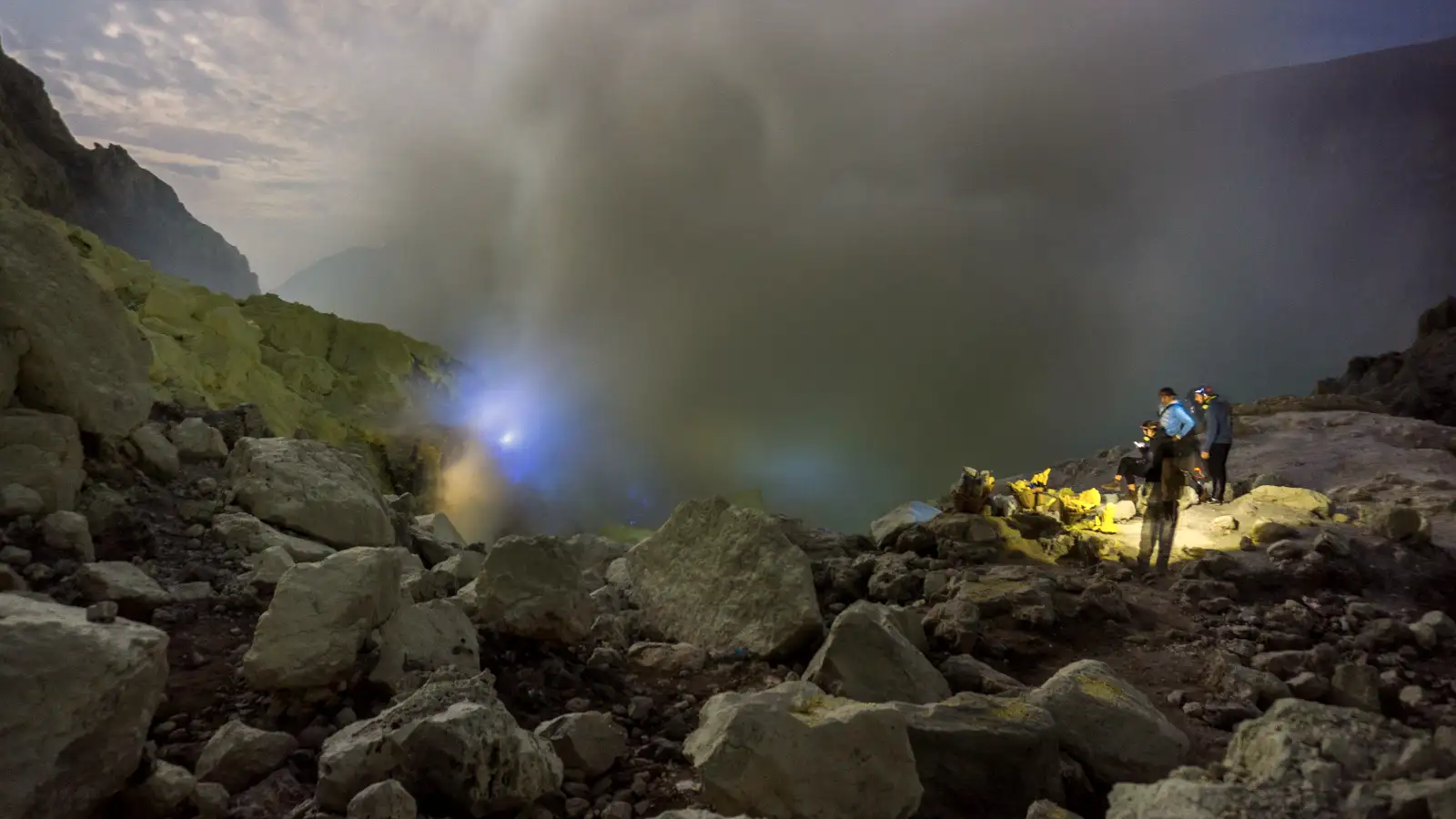 Ijen Crater Lake Ijen Crater turquoise acid lake and sulfur smoke during sunrise