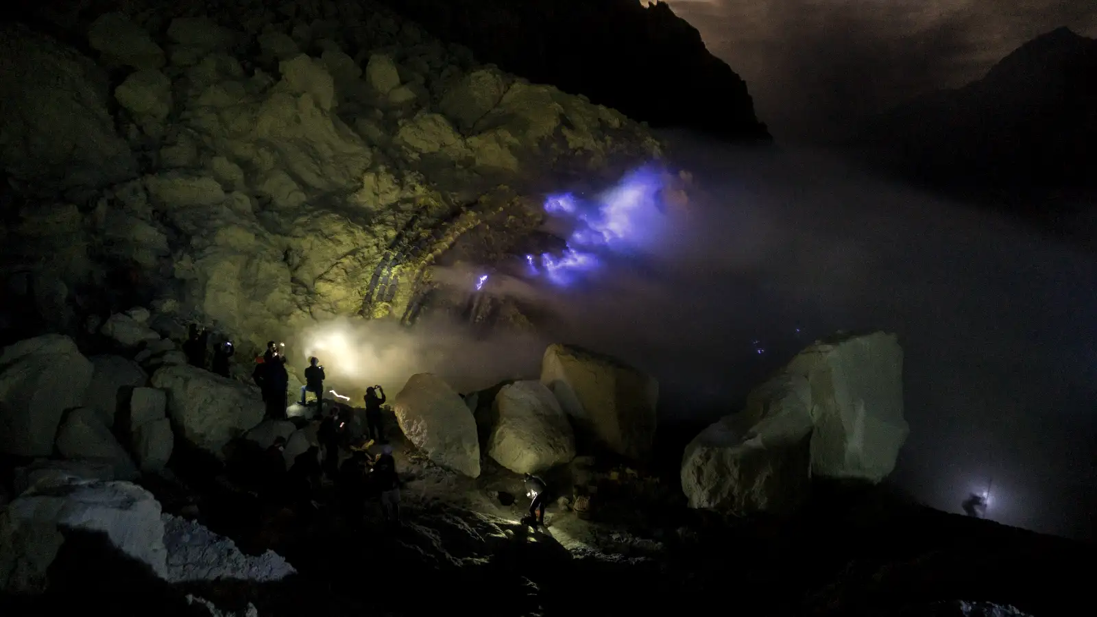 Ijen Crater Blue Fire at night with sulfur smoke