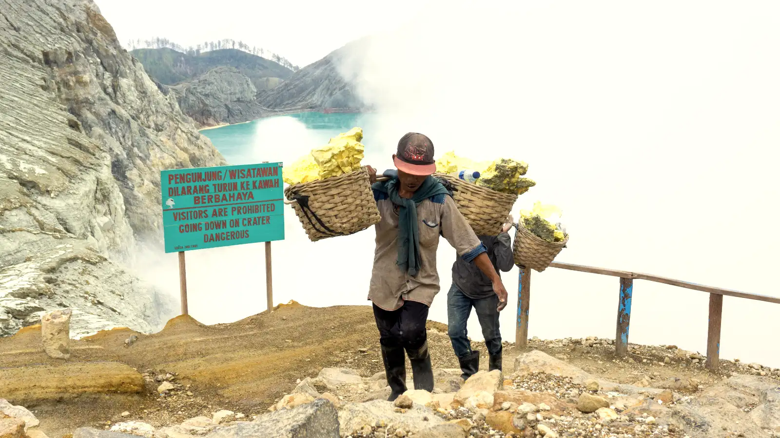 The Steep Ascent of Mount Ijen Miners walking up the steep trail of Ijen volcano