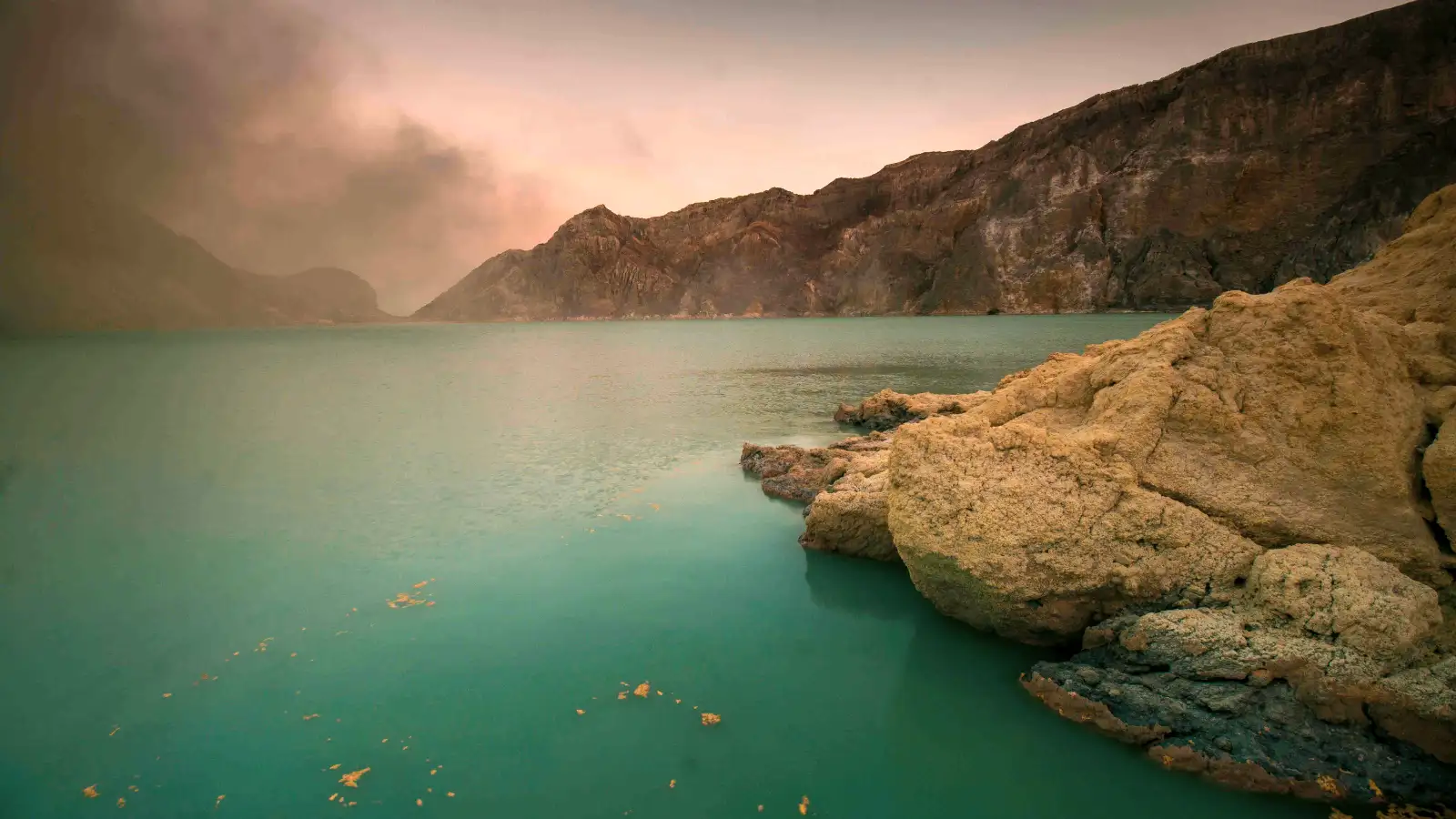Sulfur vents and acidic lake water at Ijen
