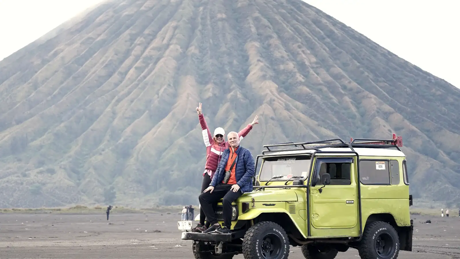 Horse riders crossing the Sea of Sand near the base of Mount Bromo